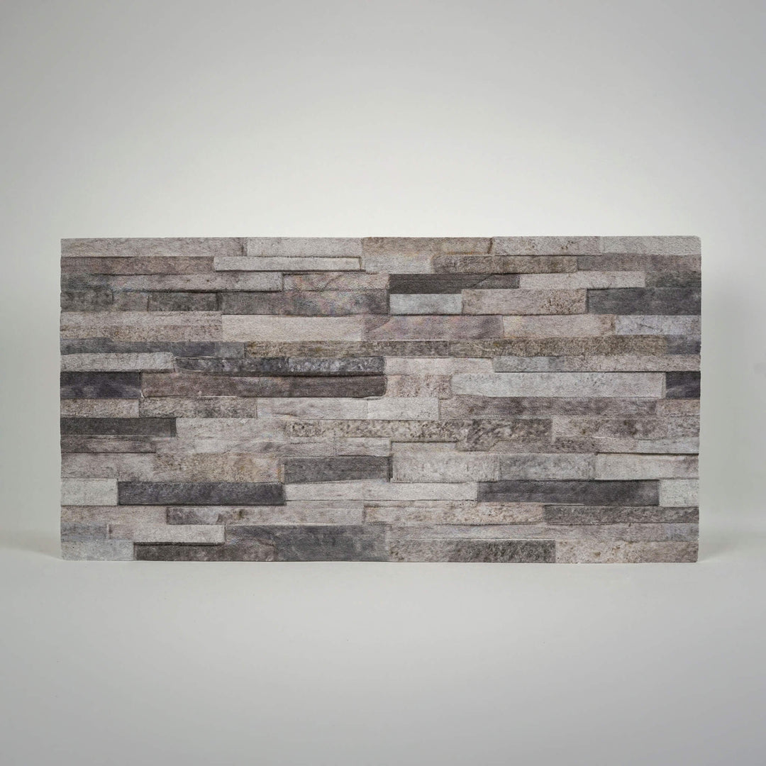 Onyx 3D faux stacked stone styrofoam wall panel with cool grey tones